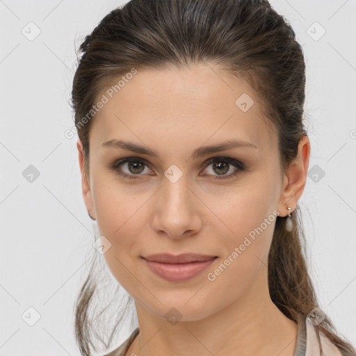 Joyful white young-adult female with long  brown hair and brown eyes