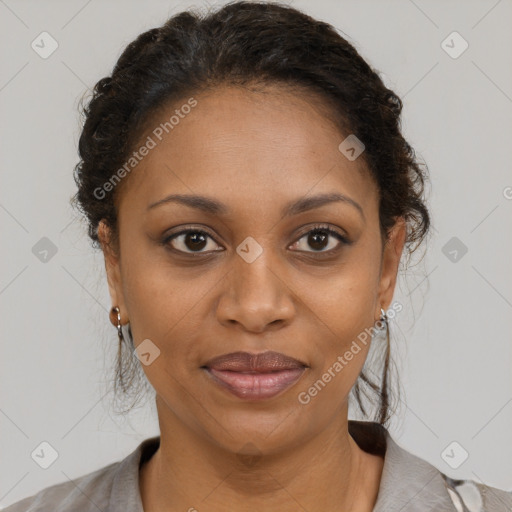 Joyful black adult female with medium  brown hair and brown eyes