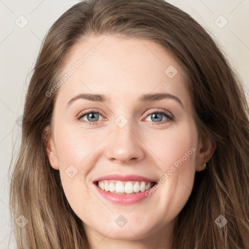 Joyful white young-adult female with long  brown hair and green eyes