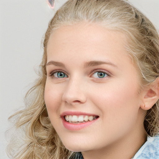 Joyful white young-adult female with medium  brown hair and blue eyes