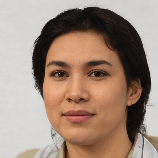 Joyful latino young-adult female with medium  black hair and brown eyes