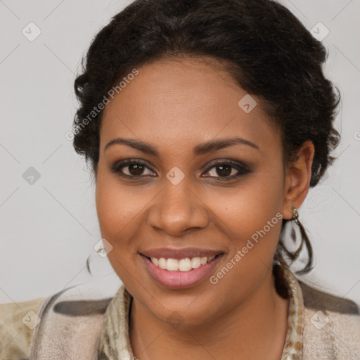 Joyful black young-adult female with long  brown hair and brown eyes