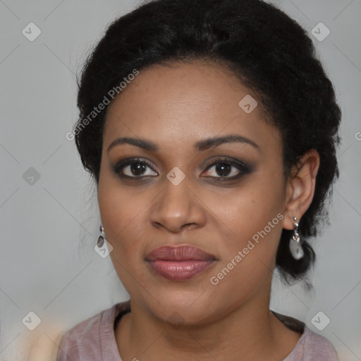 Joyful black young-adult female with medium  black hair and brown eyes