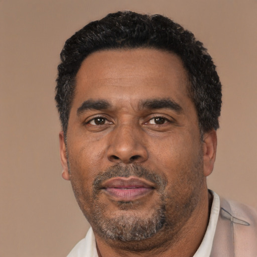 Neutral latino adult male with short  black hair and brown eyes