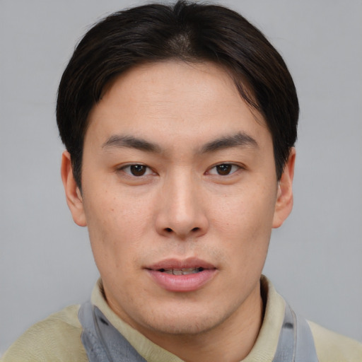 Neutral asian young-adult male with short  brown hair and brown eyes