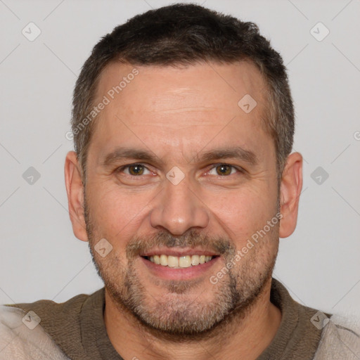 Joyful white adult male with short  brown hair and brown eyes