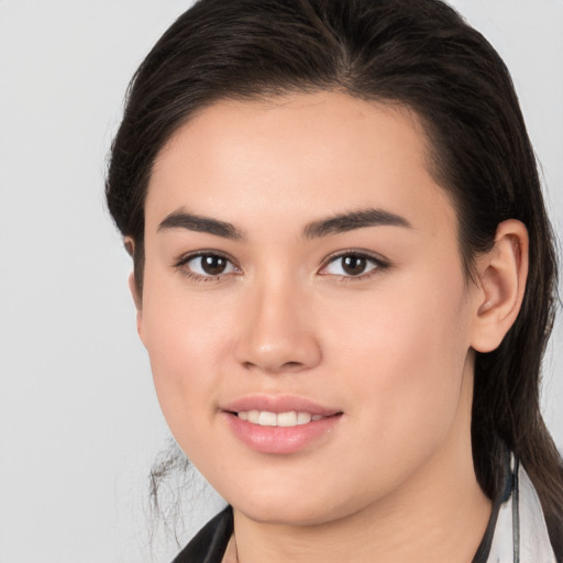 Joyful white young-adult female with medium  brown hair and brown eyes