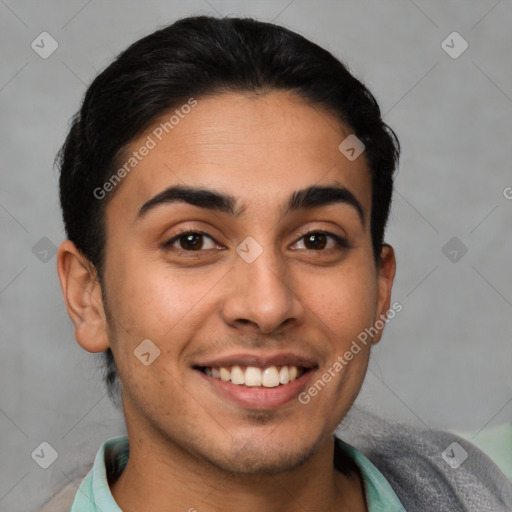 Joyful latino young-adult male with short  brown hair and brown eyes