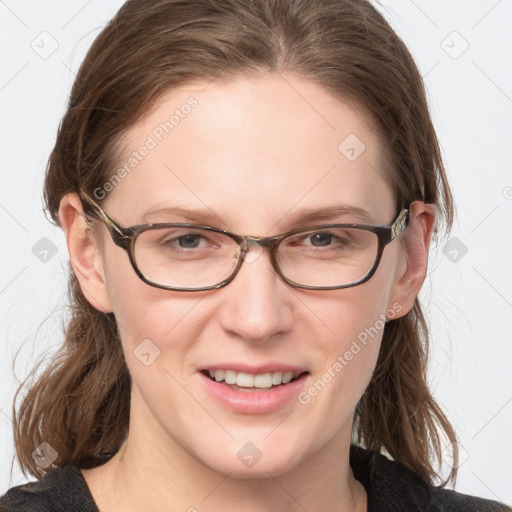 Joyful white young-adult female with medium  brown hair and blue eyes