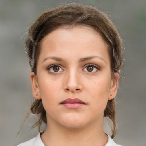 Neutral white young-adult female with medium  brown hair and brown eyes