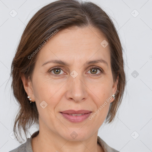 Joyful white adult female with medium  brown hair and brown eyes