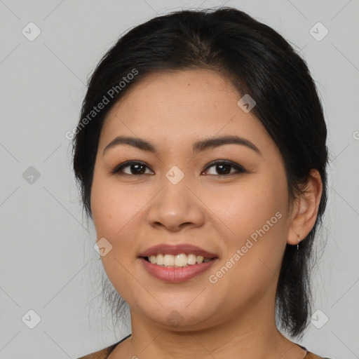 Joyful latino young-adult female with medium  black hair and brown eyes