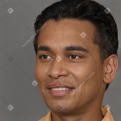 Joyful black young-adult male with short  black hair and brown eyes