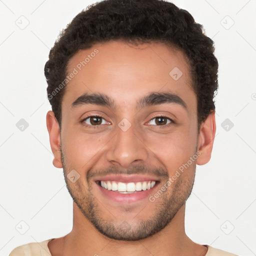 Joyful white young-adult male with short  black hair and brown eyes