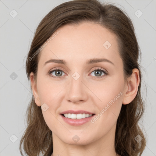 Joyful white young-adult female with medium  brown hair and blue eyes