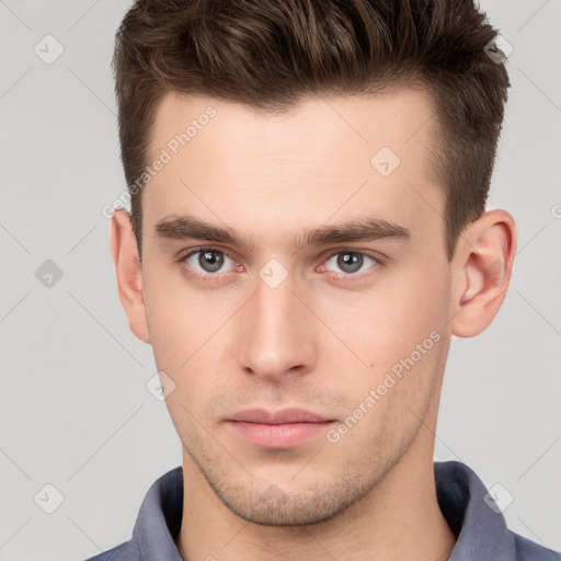 Neutral white young-adult male with short  brown hair and grey eyes