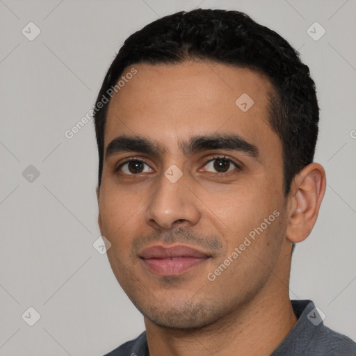 Joyful white young-adult male with short  black hair and brown eyes