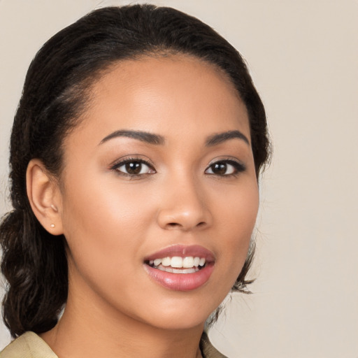 Joyful latino young-adult female with medium  brown hair and brown eyes