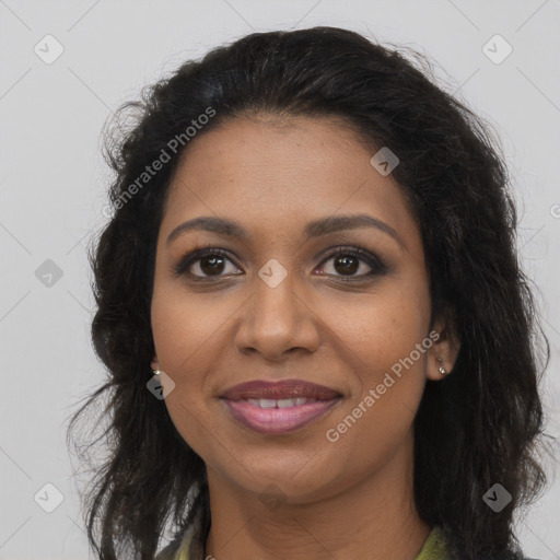 Joyful black young-adult female with long  brown hair and brown eyes