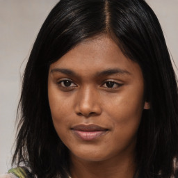 Joyful asian young-adult female with long  brown hair and brown eyes