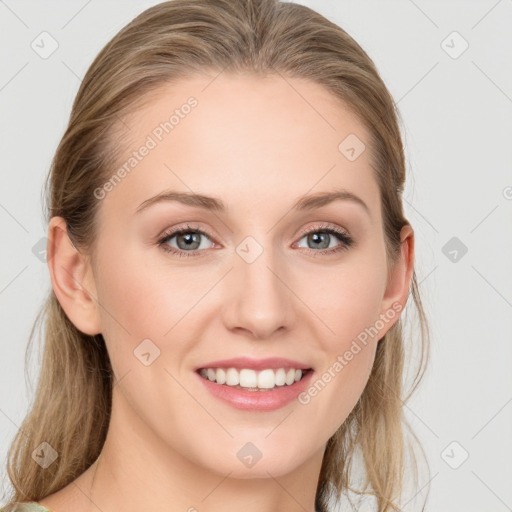 Joyful white young-adult female with medium  brown hair and blue eyes