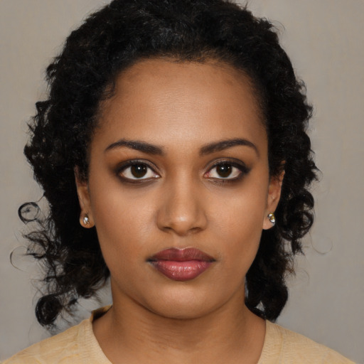 Neutral black young-adult female with long  black hair and brown eyes