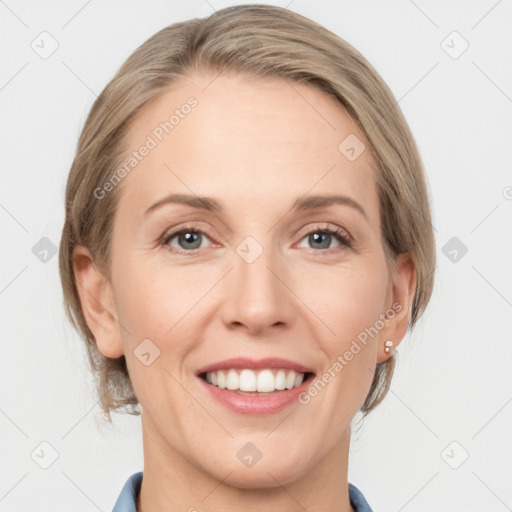 Joyful white adult female with medium  brown hair and grey eyes