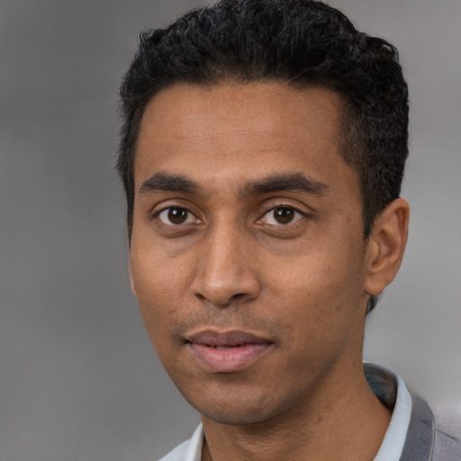 Neutral black young-adult male with short  black hair and brown eyes