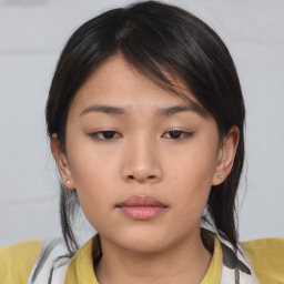 Neutral asian young-adult female with medium  brown hair and brown eyes