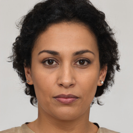 Neutral latino young-adult female with short  brown hair and brown eyes