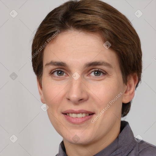 Joyful white adult female with short  brown hair and grey eyes