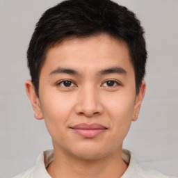 Joyful asian young-adult male with short  brown hair and brown eyes