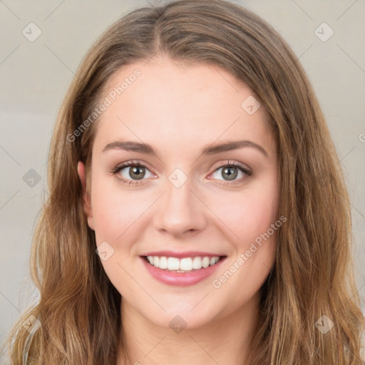 Joyful white young-adult female with long  brown hair and green eyes