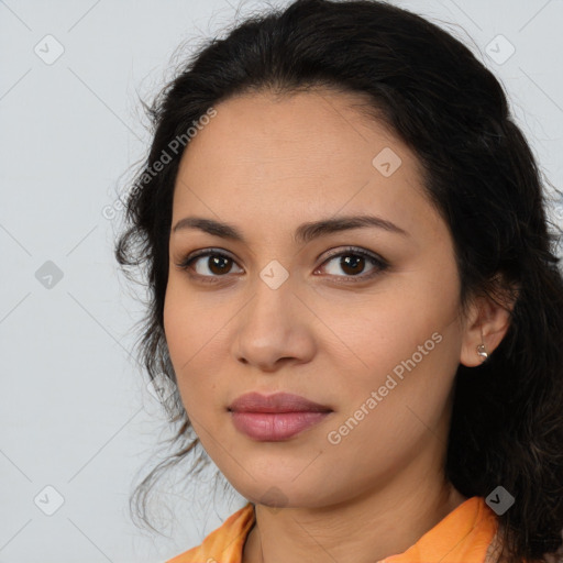 Joyful latino young-adult female with long  brown hair and brown eyes