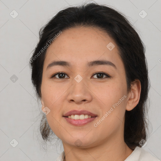 Joyful latino young-adult female with medium  brown hair and brown eyes