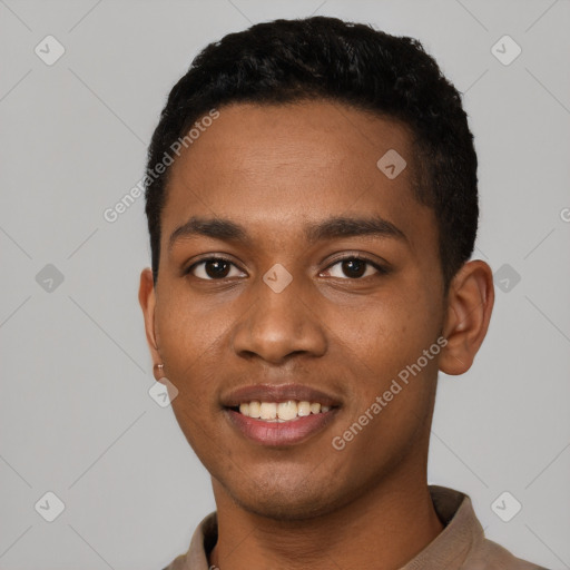 Joyful black young-adult male with short  black hair and brown eyes