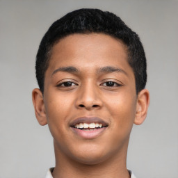 Joyful latino young-adult male with short  brown hair and brown eyes