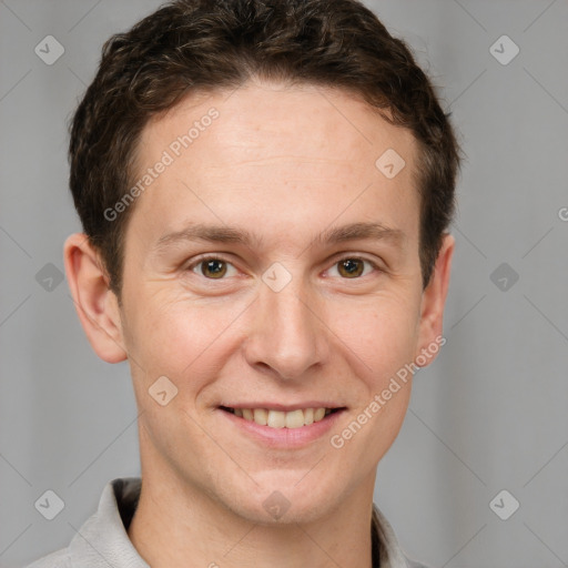 Joyful white adult male with short  brown hair and grey eyes