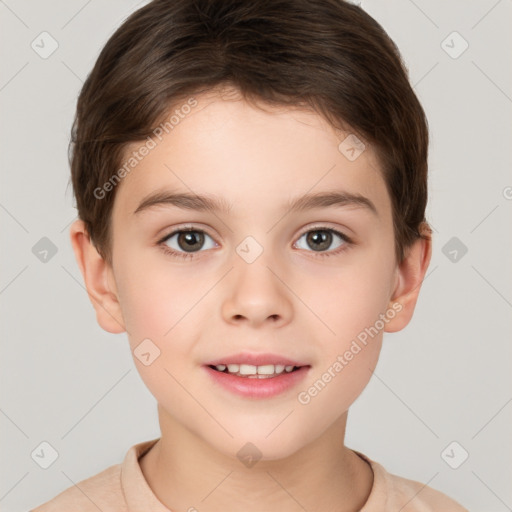 Joyful white child male with short  brown hair and brown eyes