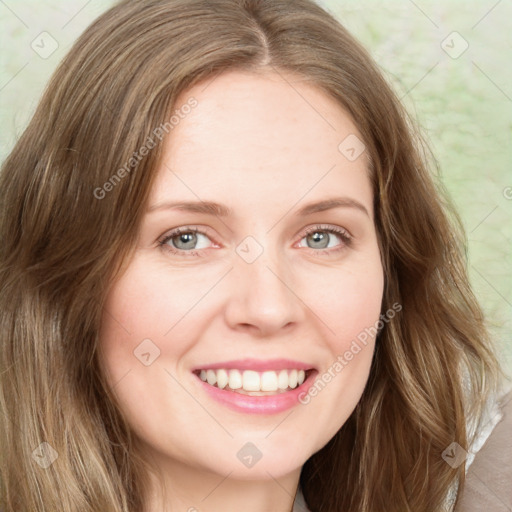 Joyful white young-adult female with long  brown hair and green eyes