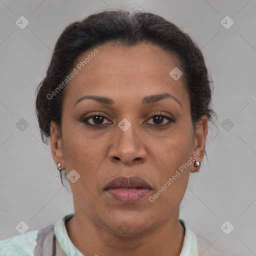 Joyful black adult female with short  brown hair and brown eyes