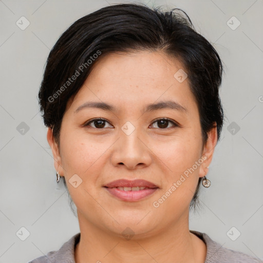 Joyful asian young-adult female with short  brown hair and brown eyes