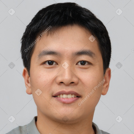 Joyful asian young-adult male with short  black hair and brown eyes