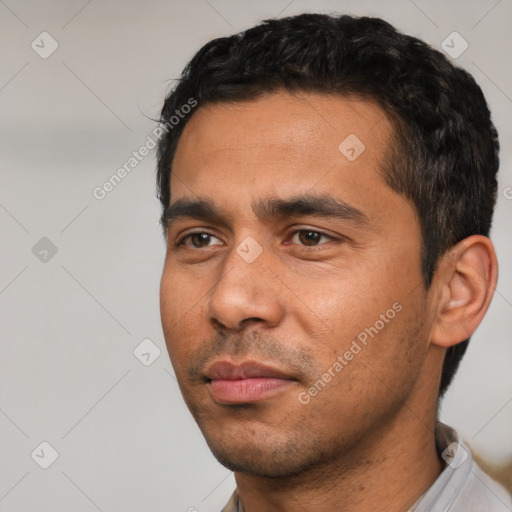 Neutral white young-adult male with short  black hair and brown eyes