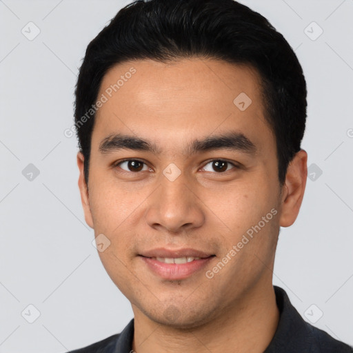 Joyful latino young-adult male with short  black hair and brown eyes