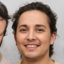 Joyful white adult male with medium  brown hair and brown eyes