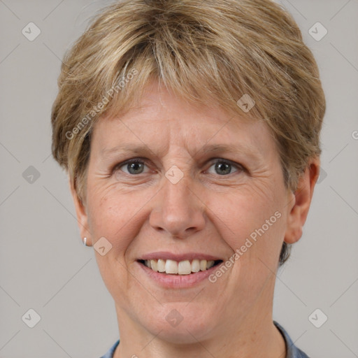 Joyful white adult female with short  brown hair and grey eyes