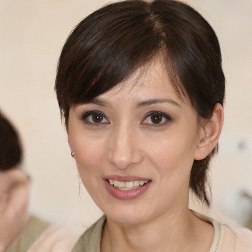 Joyful white young-adult female with medium  brown hair and brown eyes