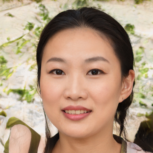 Joyful asian young-adult female with medium  brown hair and brown eyes