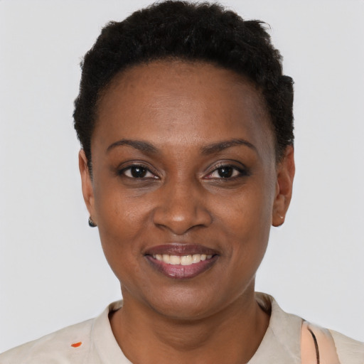 Joyful black young-adult female with short  brown hair and brown eyes